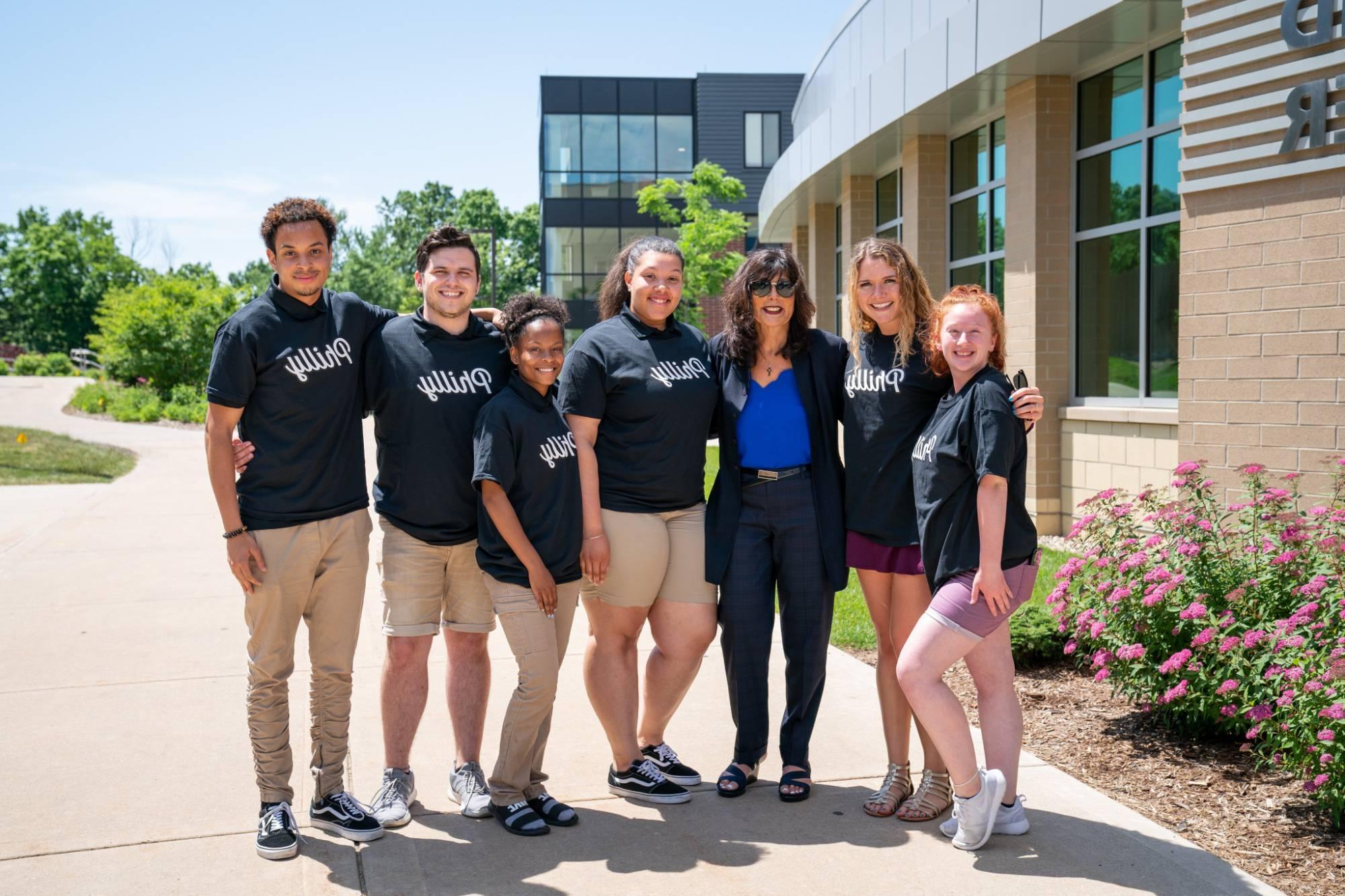 President Mantella with a group of students wearing matching "Philly" shirts.